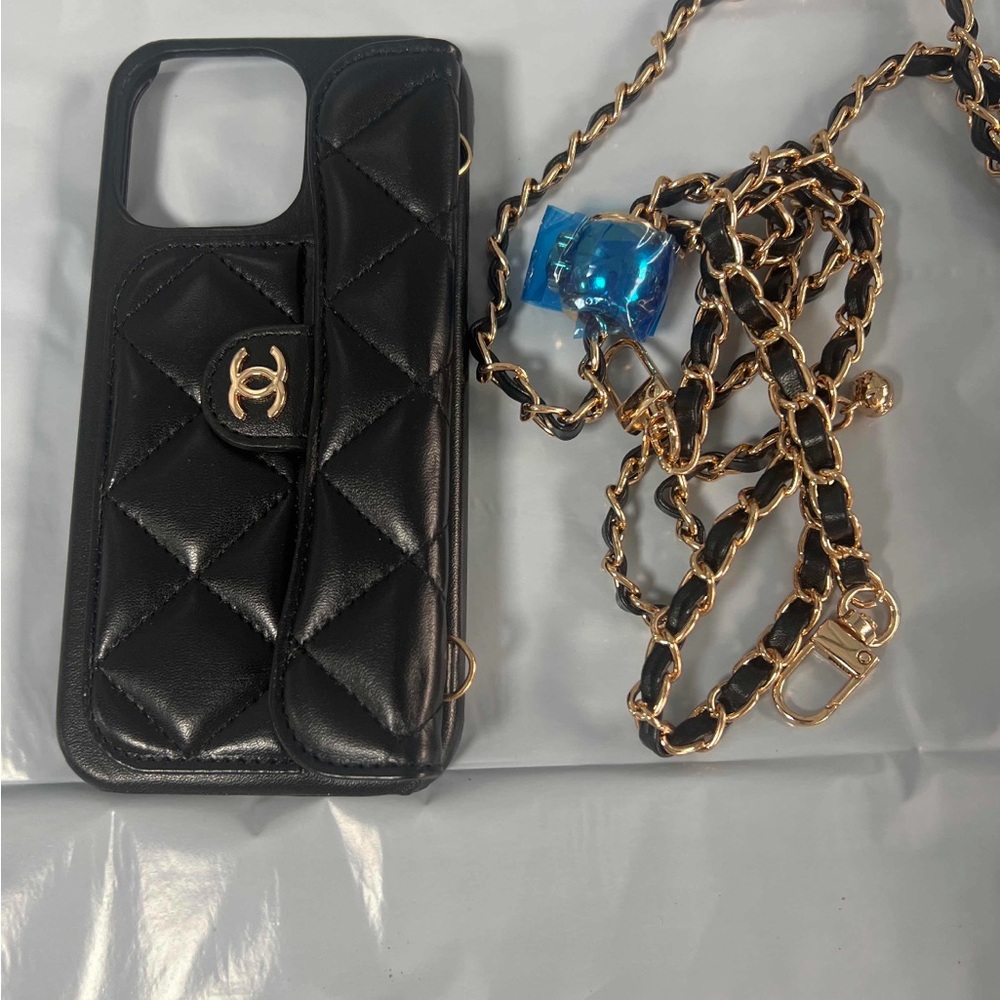 CHANEL Black Quilted Phone Case with Gold Chain Accent